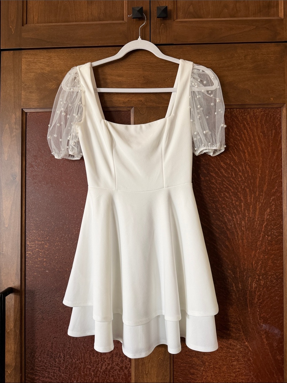 Woman’s sweet white dress size (1 )small pearl w/sleeves
